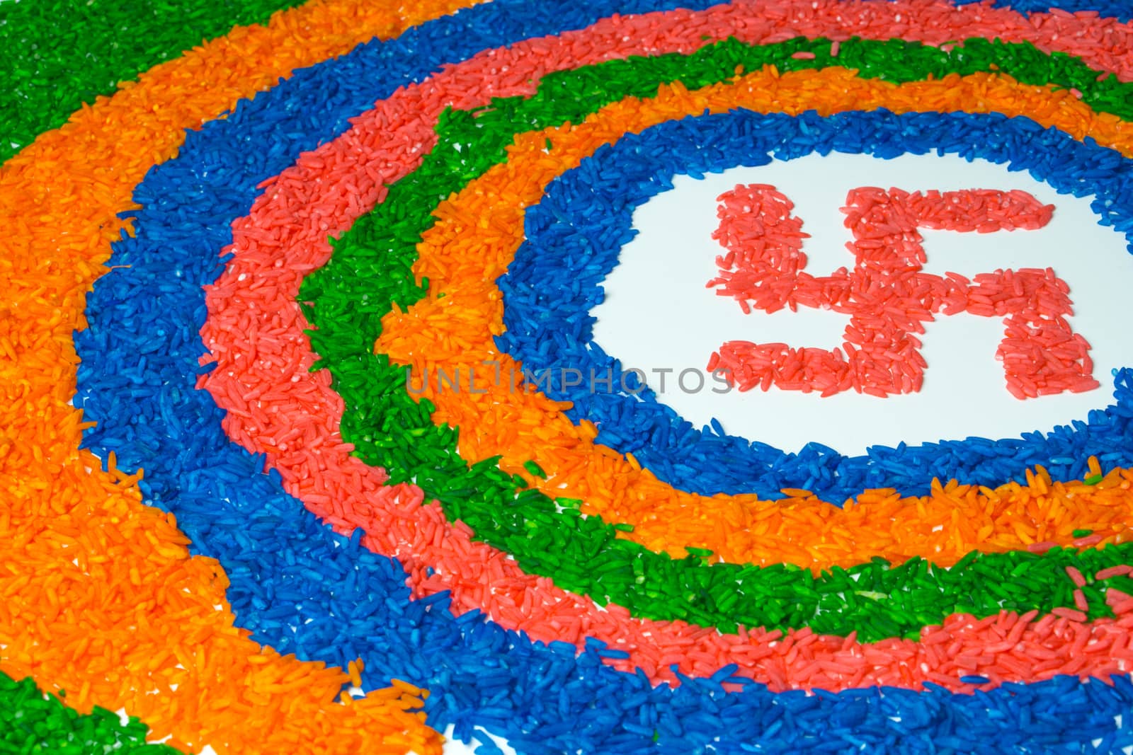 Indian festival Diwali, Diya oil lamps lit on colorful rangoli w by mikesaran