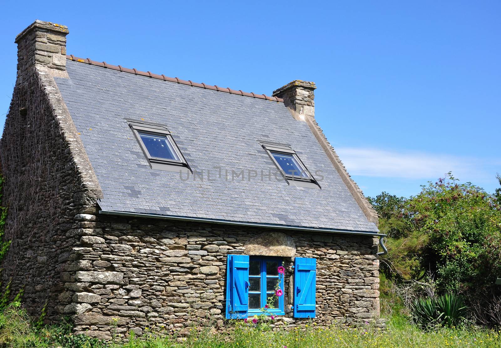 stone house on the island of Groix in summer, France. countryside, sea and calm