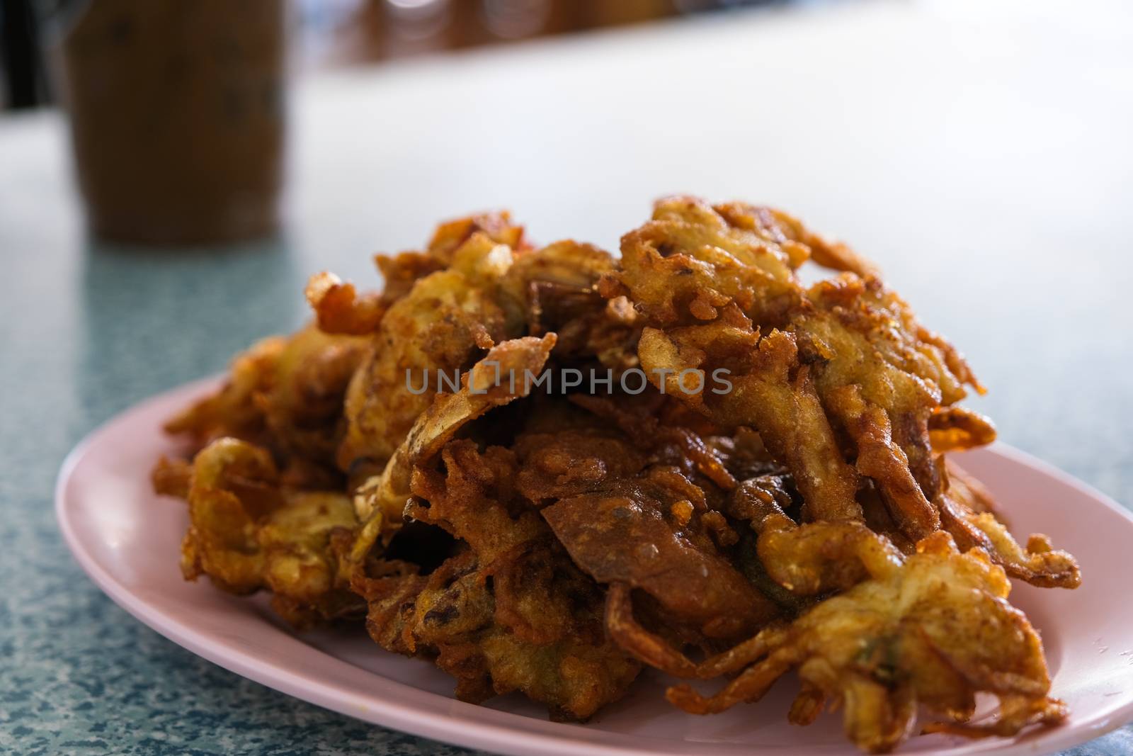 The Soft Shell Crab fried with garlic on plate in restaurant.