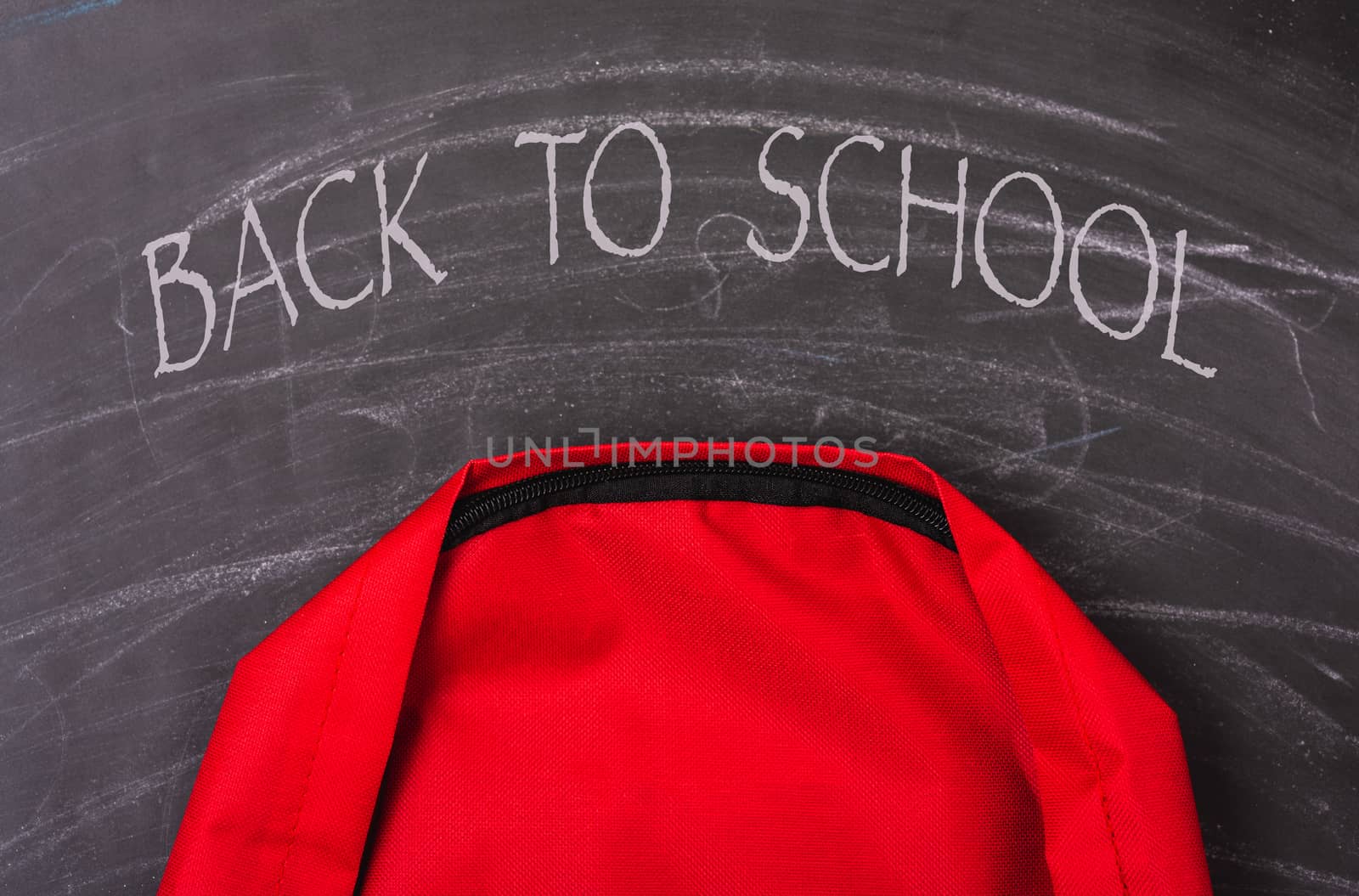 Back to school shopping pocket backpack on the education red bag on blackboard and chalkboard