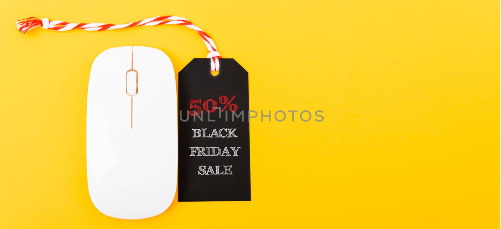 Online shopping Black Friday sale text black tag on white mouse by Sorapop