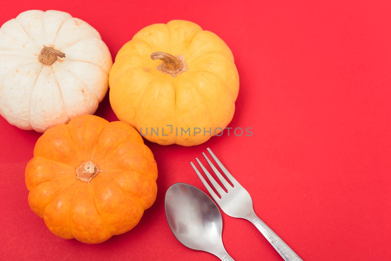 Halloween and Thanksgiving day pumpkins and leaves by Sorapop