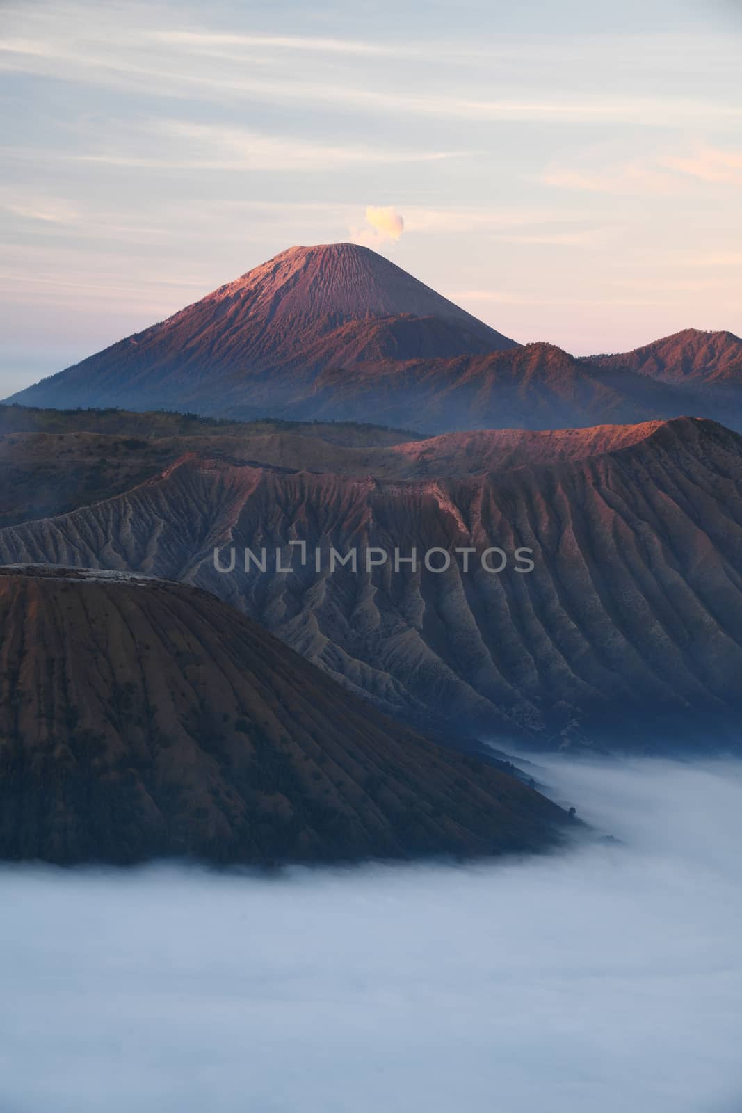 Bromo mountain with fog layer at sunrise, East Java, Indonesia