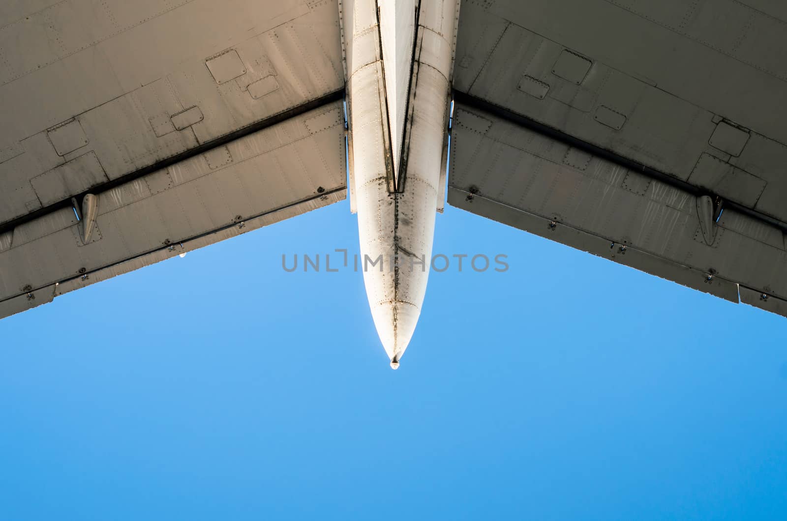 fragment of airplane wings on a background of blue sky isolated background