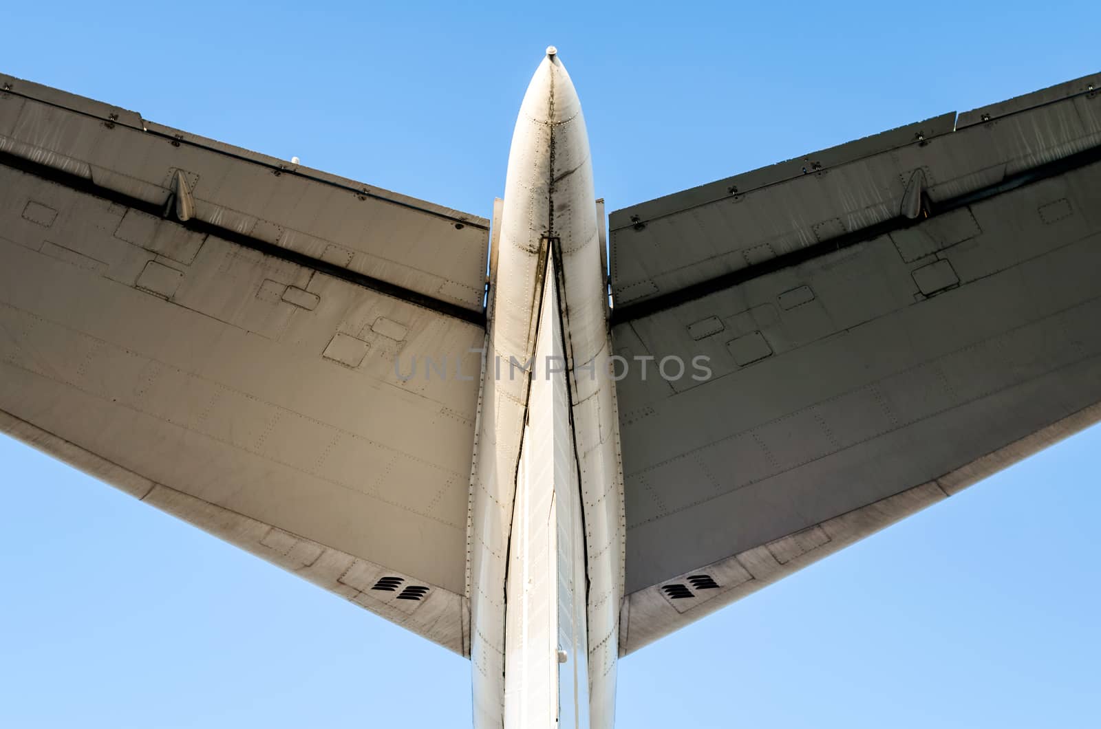 fragment of airplane wings on a background of blue sky isolated background