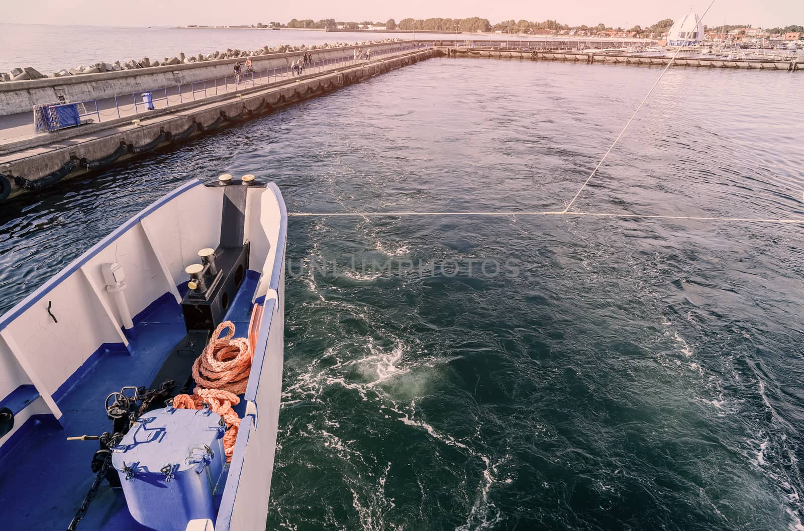 The nose of the ship, the bow of the floating ship, the cruise liner, the yacht, the boat on the background of the blue salt sea, the ocean on the tropical sea warm resort,