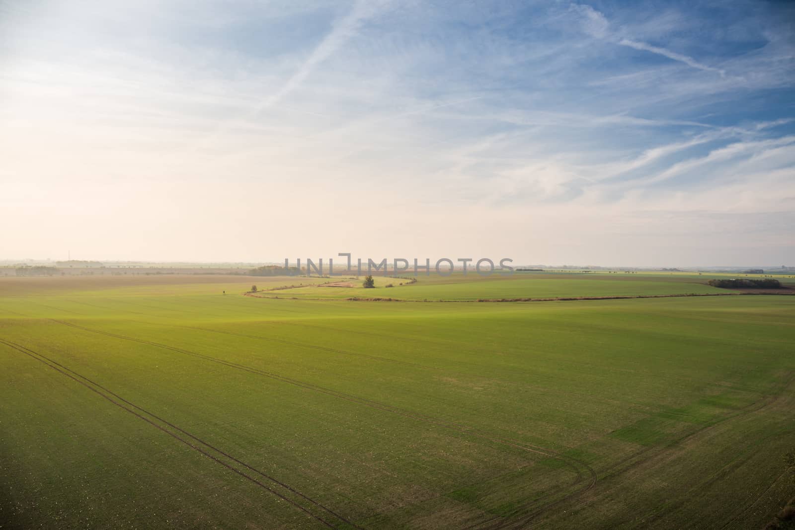 Panorama of beautiful fields in South Bohemian Moravian Tuscany, czech republic, nice blue sky with sun in the evening. by petrsvoboda91