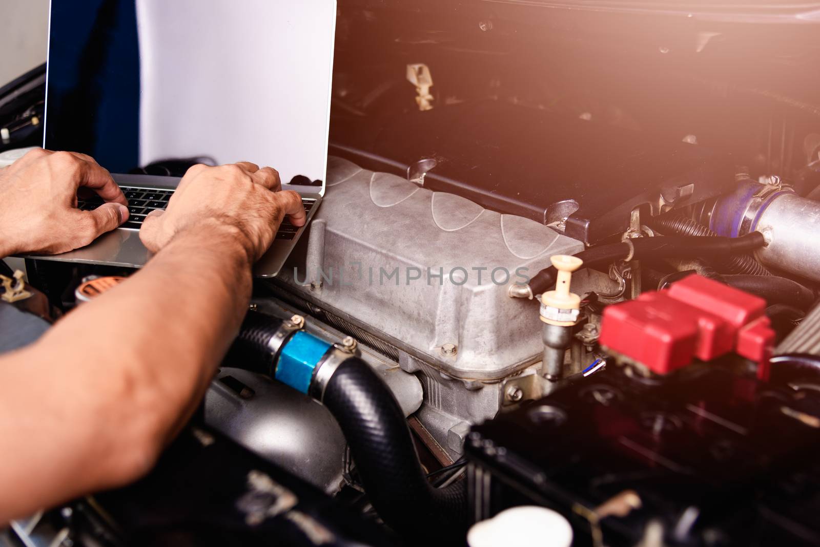 Professional car repair or maintenance mechanic engine working s by Sorapop