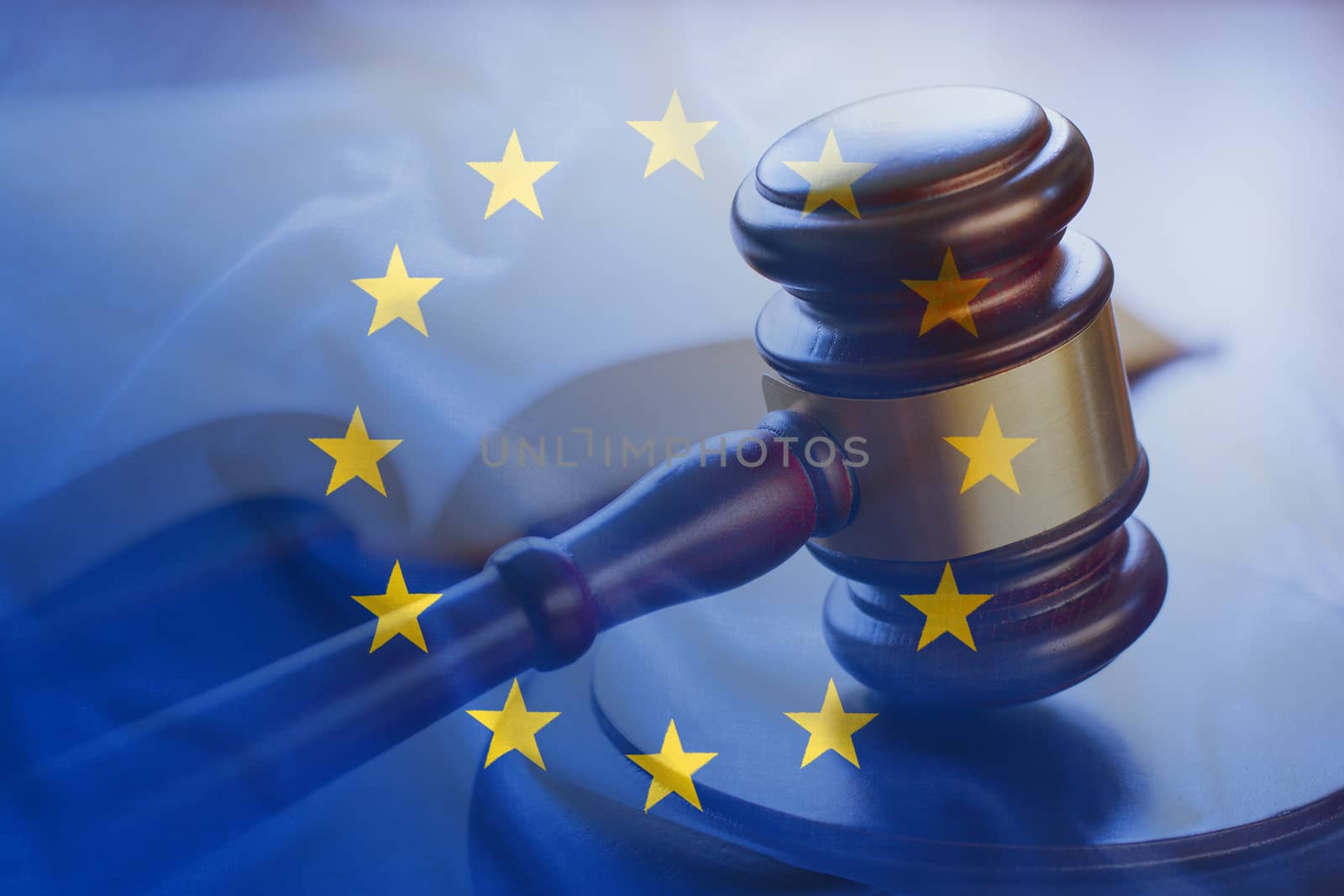 European Union flag with wooden gavel in close-up by sergii_gnatiuk