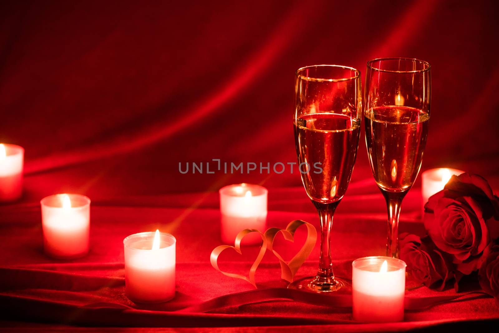 Valentines day background with champagne glasses roses candles and hearts