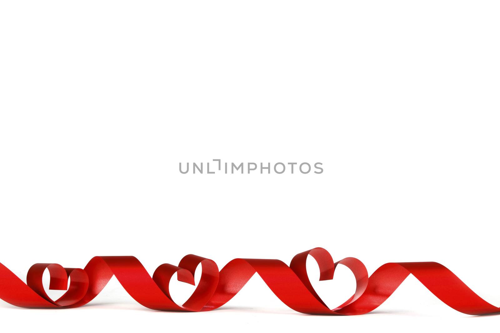 Red heart shaped ribbon isolated on white background Valentines day design