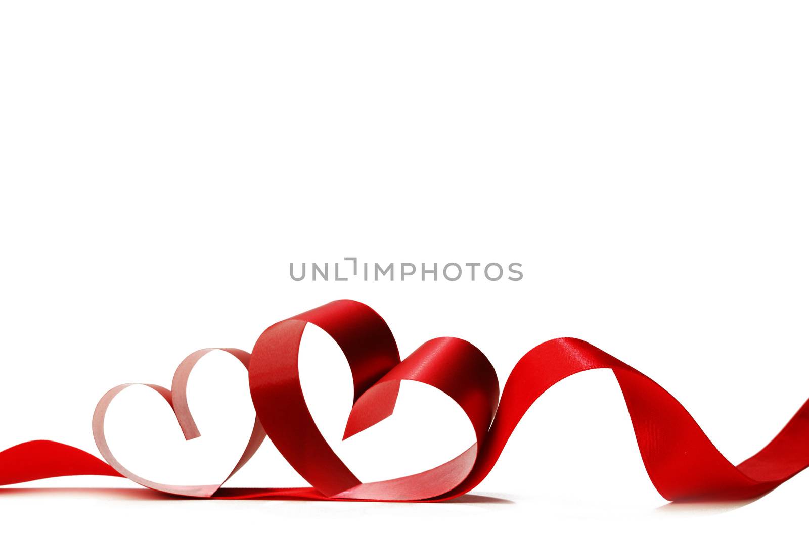 Red heart shaped ribbon isolated on white background Valentines day design