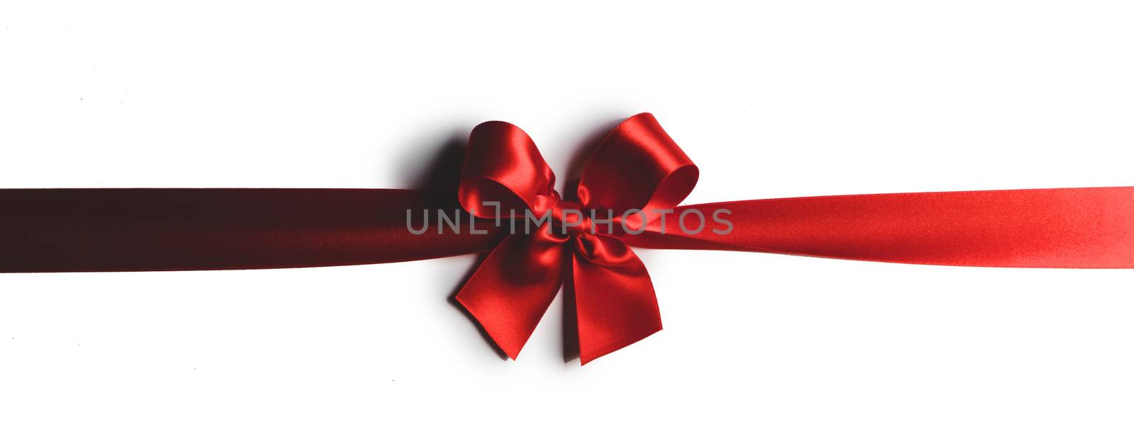 Elegant satin red ribbon bow isolated on white background