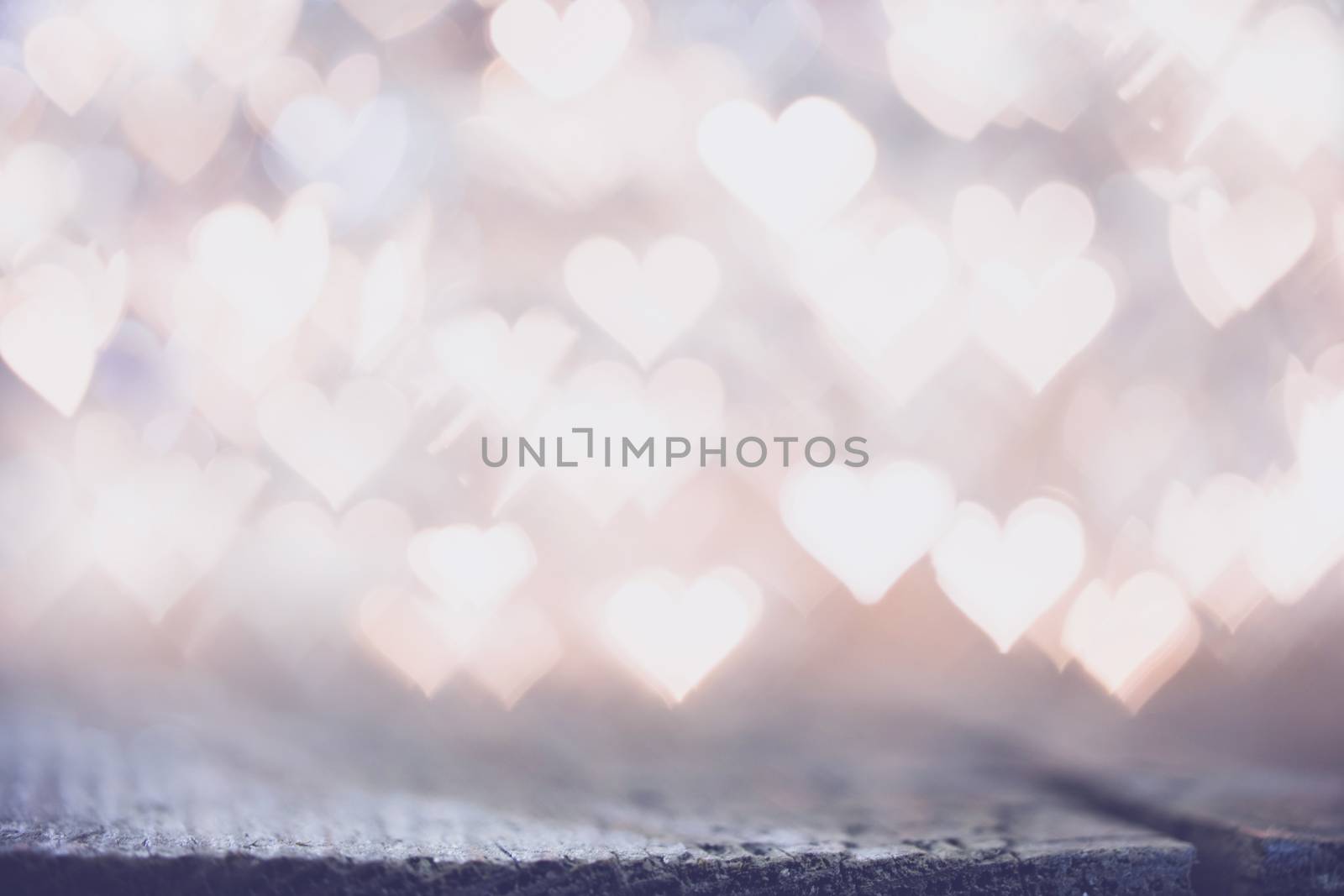 Glowing beautiful golden bokeh lights background. Vintage style. Love Valentine's Day concept.