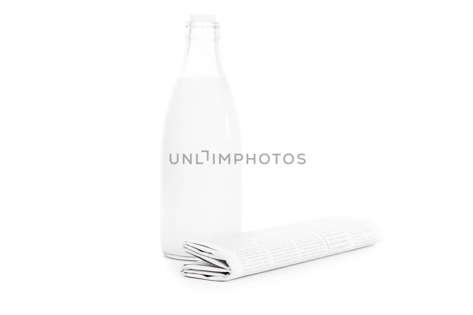 Close up shot of a rolled up newspaper and an old school bottle of milk, isolated on white background.