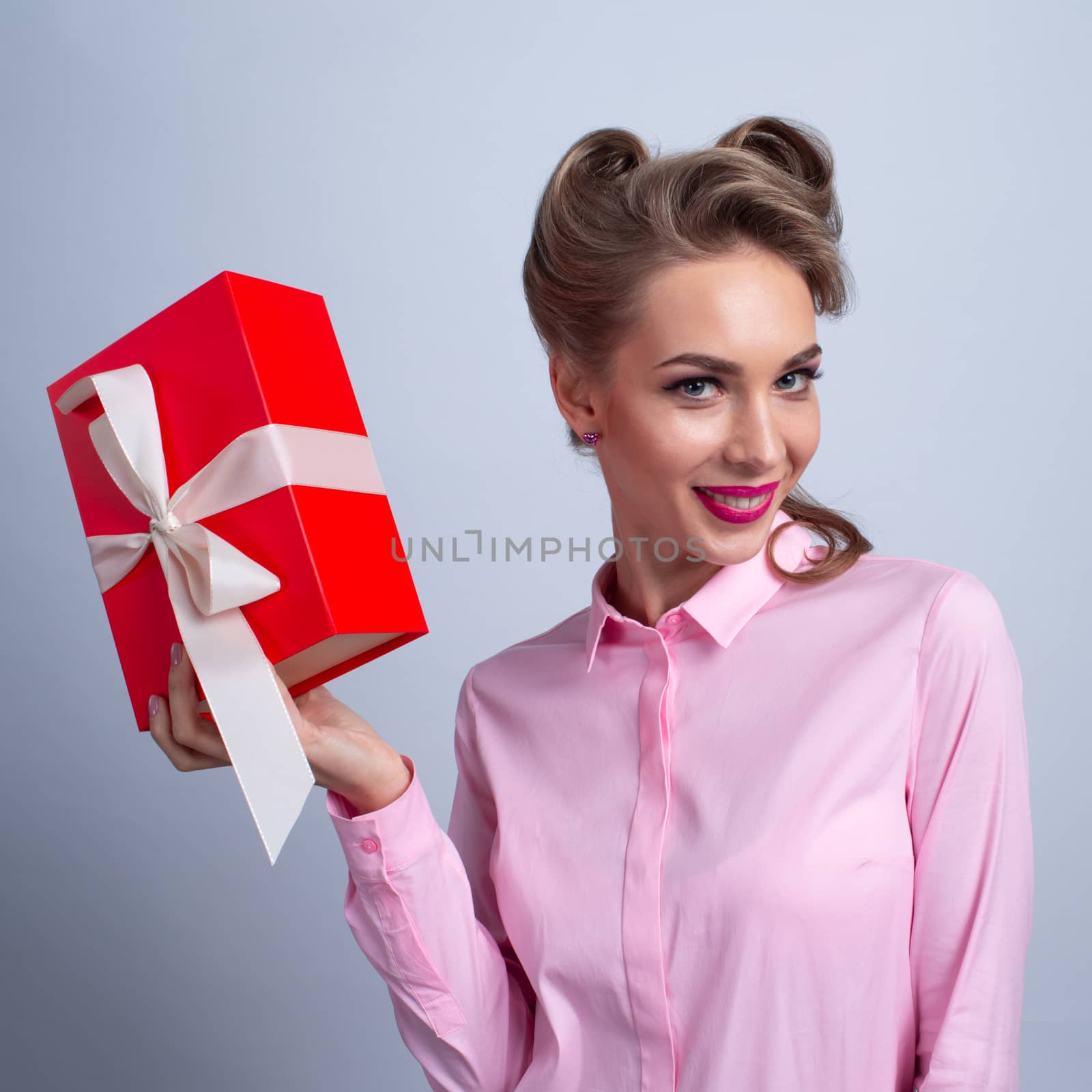 Woman holding gift box and want to open. Christmas, new year, birthday, Valentine, Valentines day