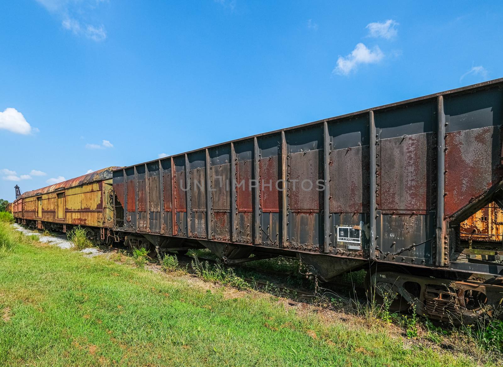 Rusty Train Cars on Track by dbvirago