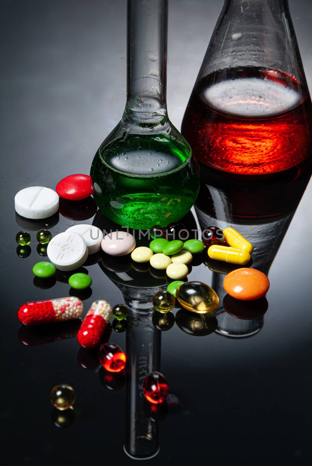 Glass chemical tableware on a glass background