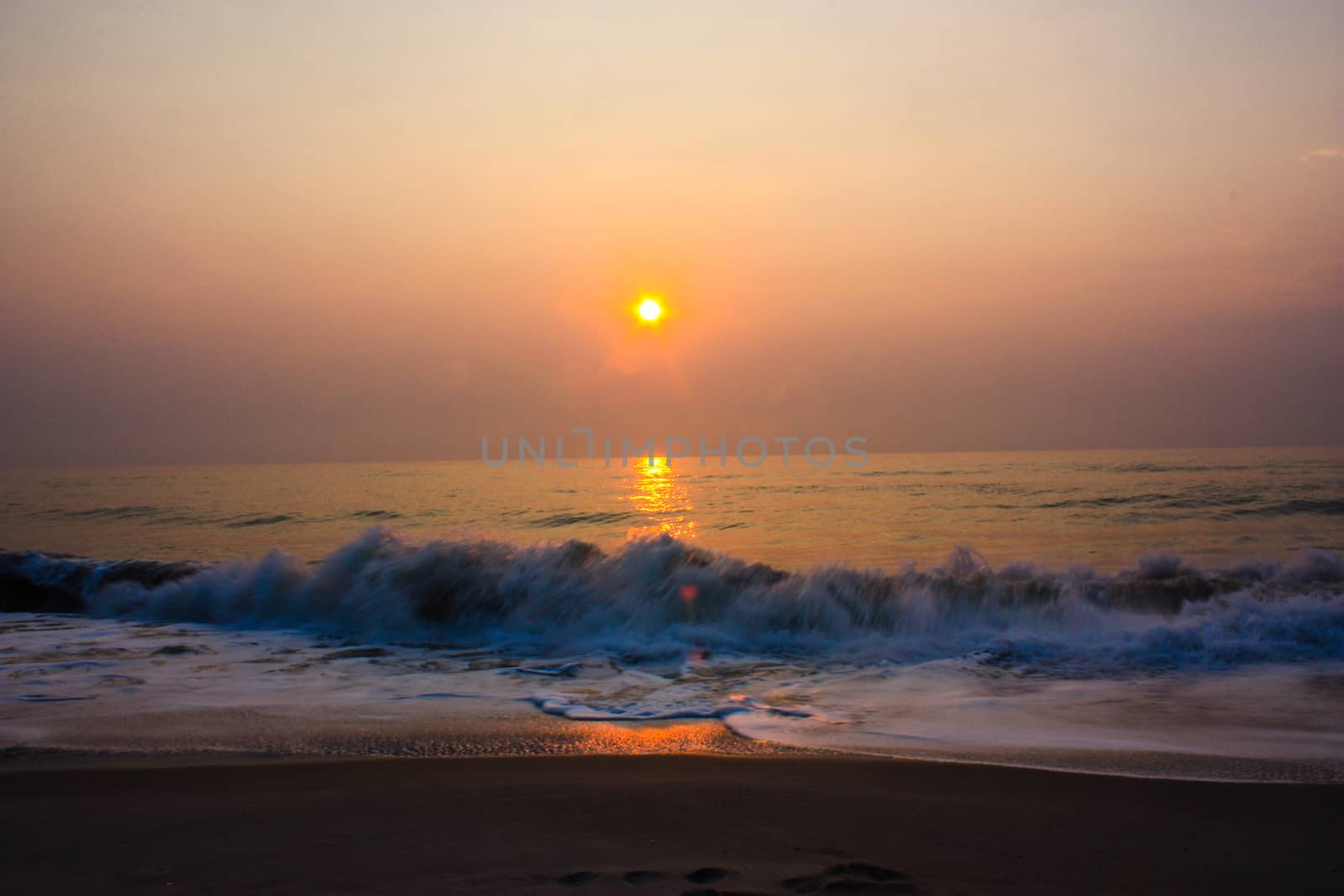 Sunset or Sundown on Sea. Bright sun on sky. Sunrises Orange beach landscape