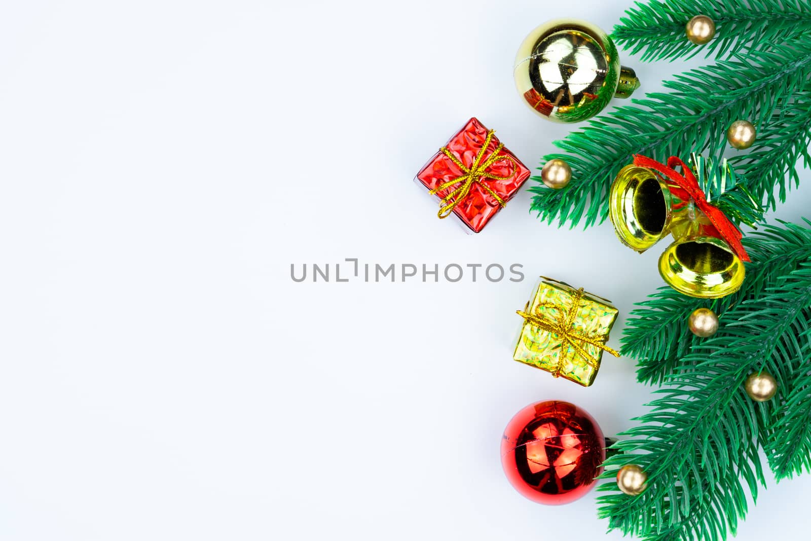 Christmas holidays composition, top view of red and gold Christmas decorations on white background with copy space for text. Flat lay, winter, postcard template, new year concept.