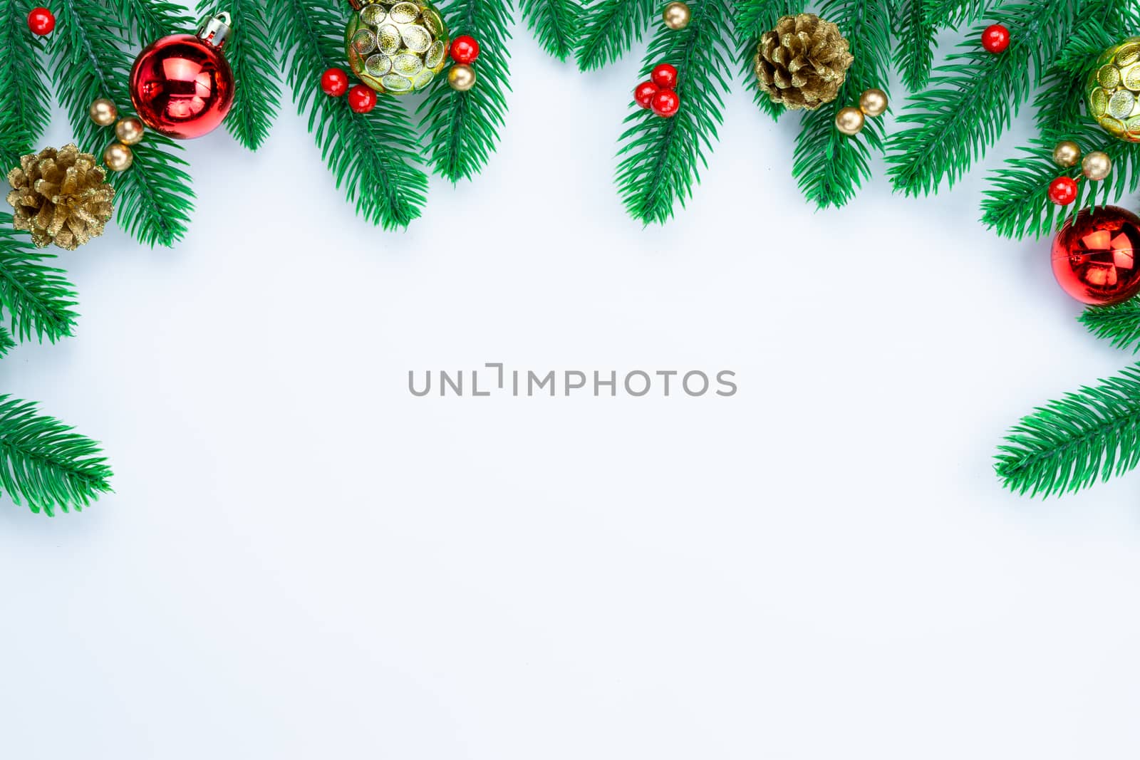 Christmas holidays composition, top view of red and gold Christmas decorations on white background with copy space for text. Flat lay, winter, postcard template, new year concept.