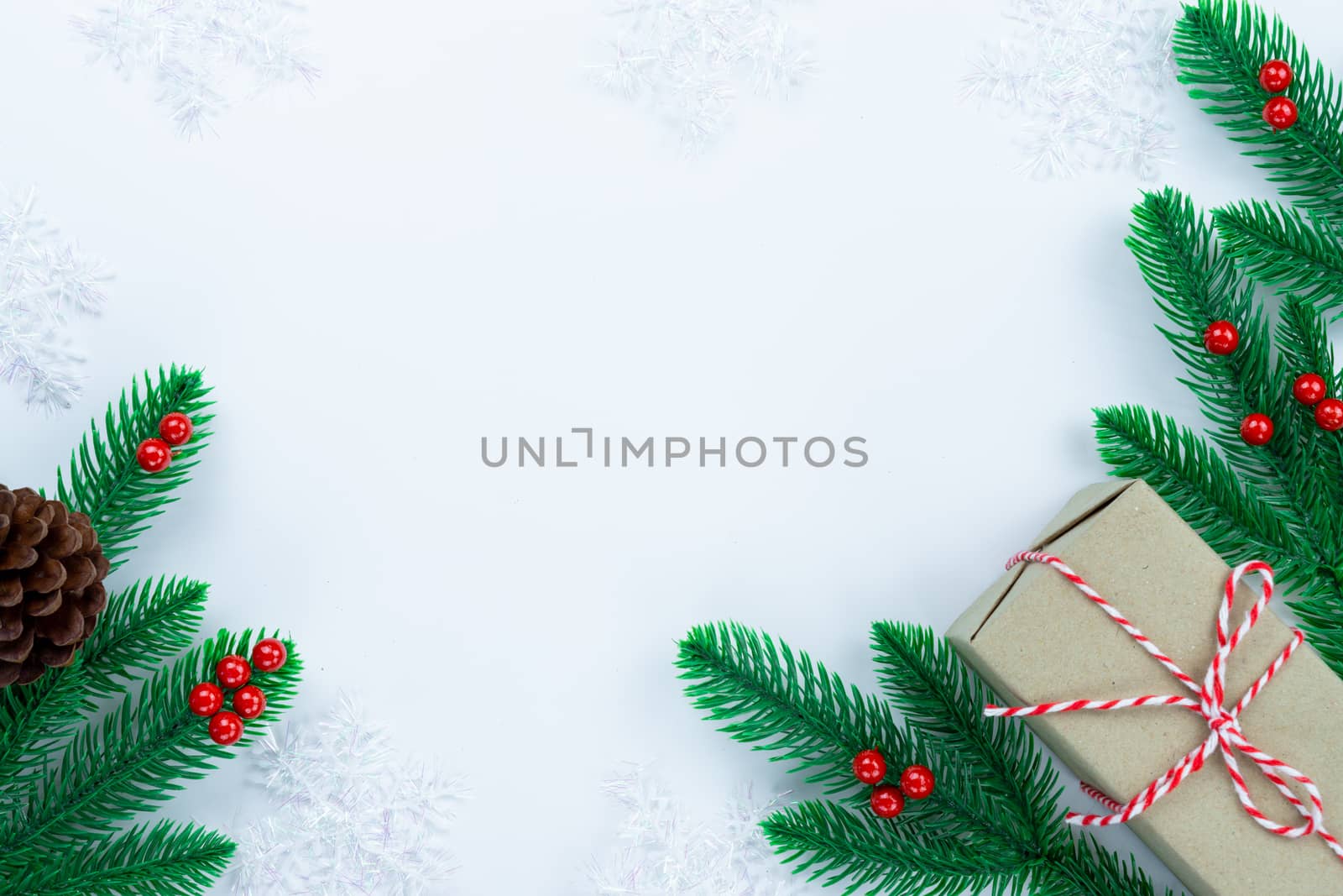 Christmas holidays composition, top view of red and gold Christmas decorations on white background with copy space for text. Flat lay, winter, postcard template, new year concept.