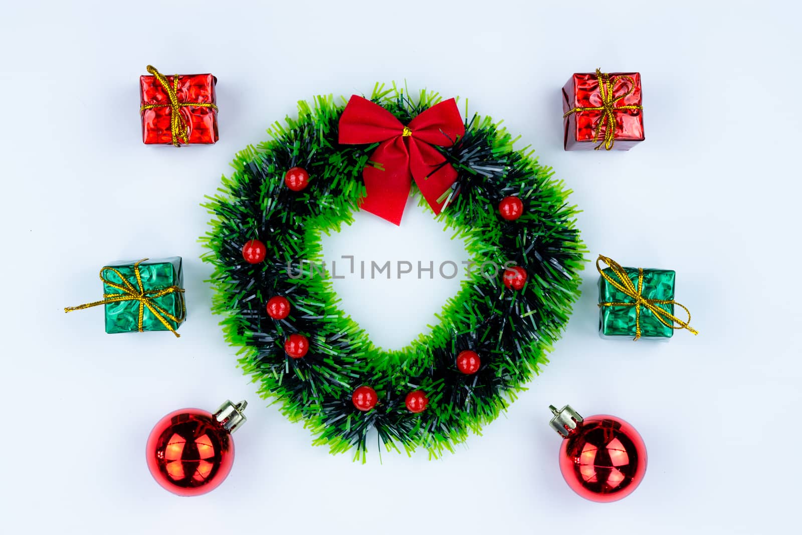 Christmas holidays composition, top view of Christmas garland and gift decoration on white background with copy space for text. Flat lay, winter, postcard template, new year concept.