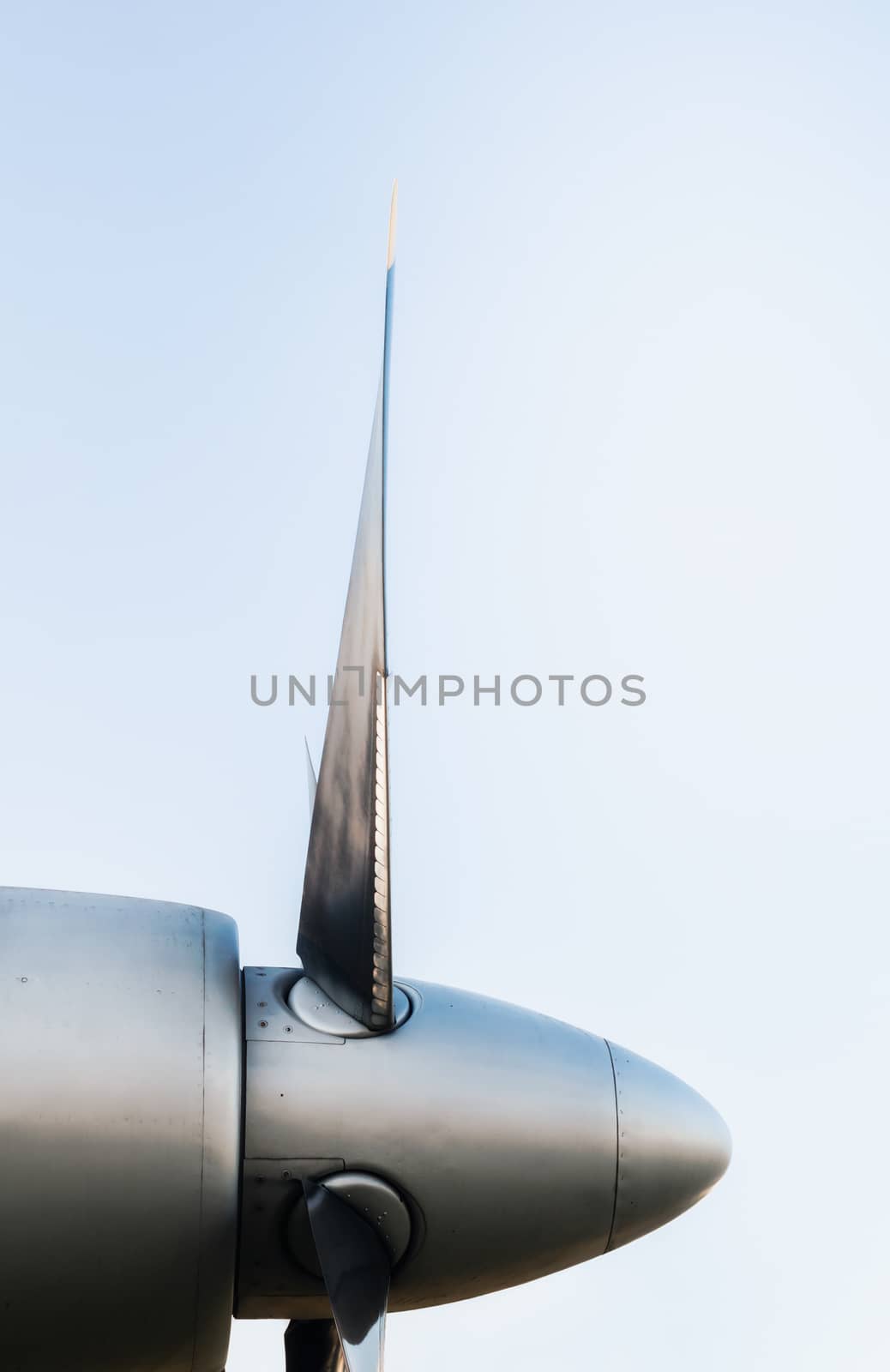 airplane propeller blades on blue background isolated close up