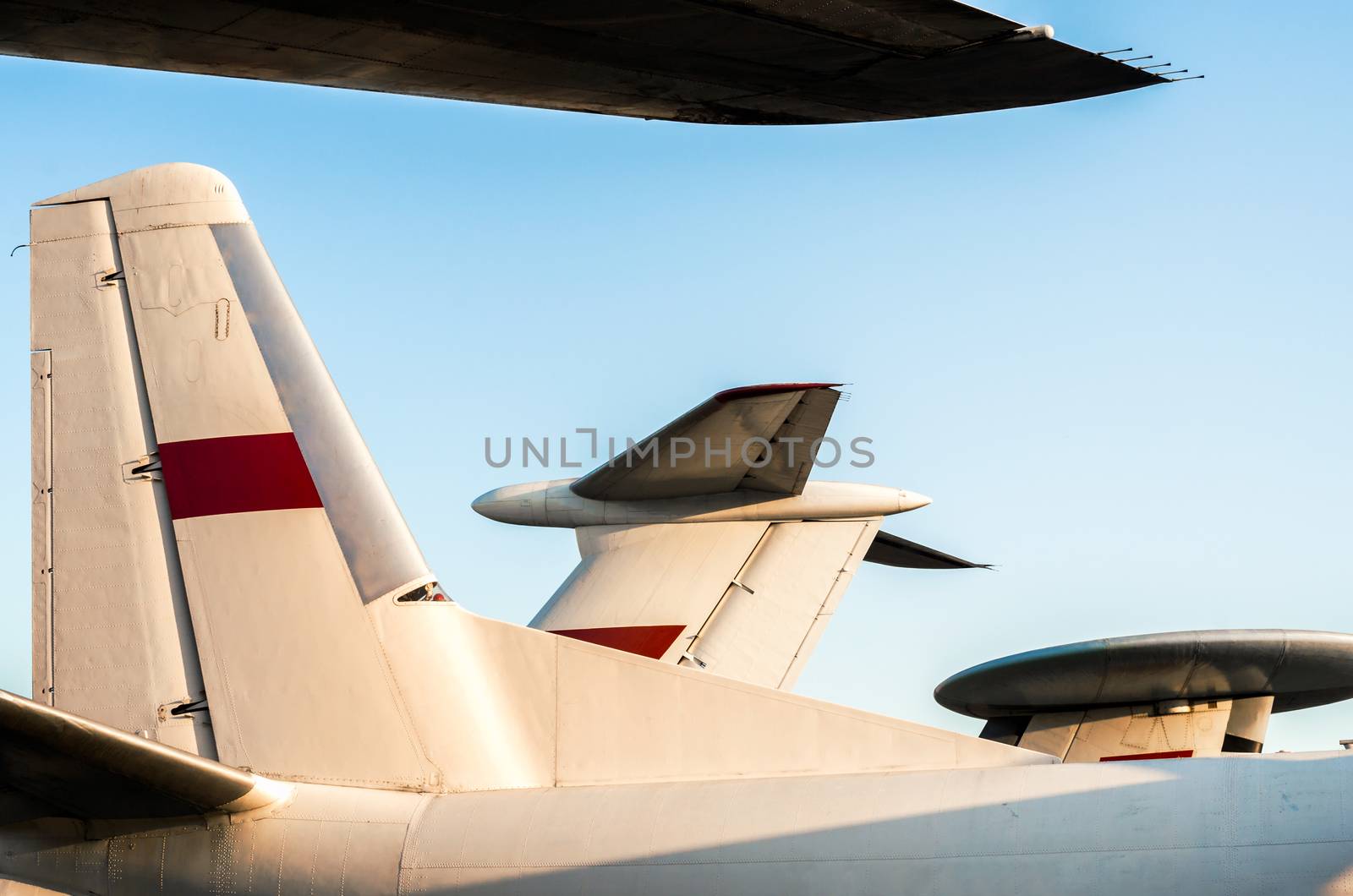 background wings of a large soviet airliner against a blue sky isolated close up