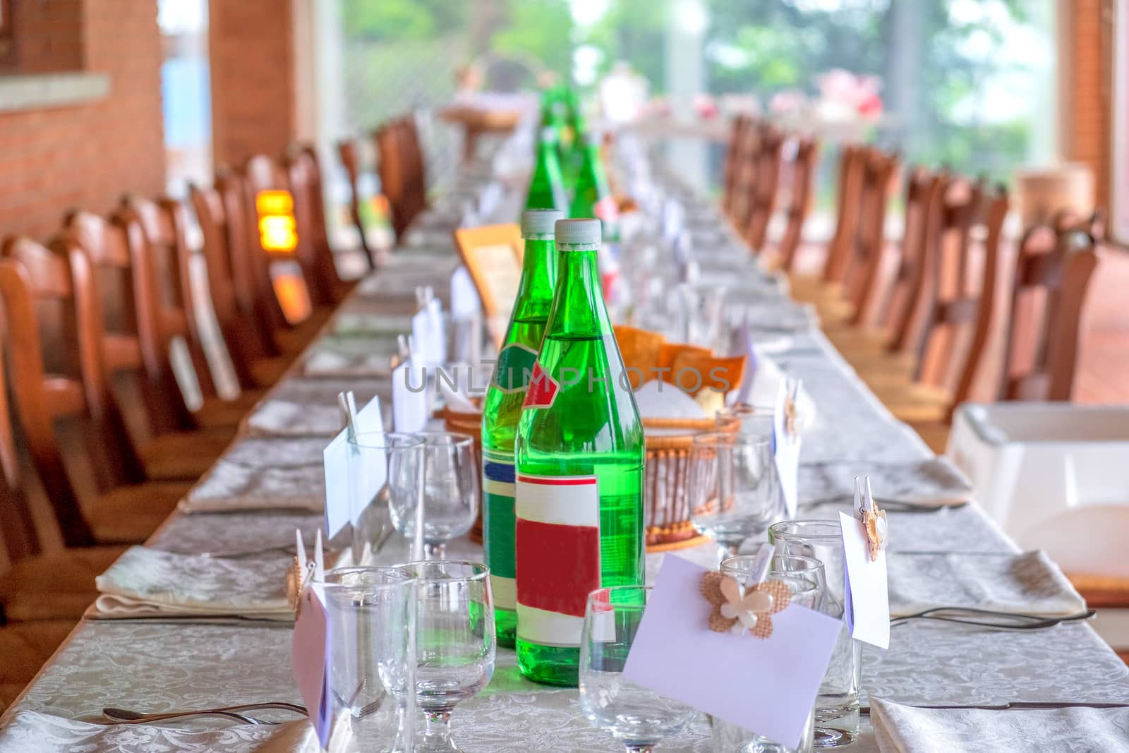 restaurant invitation prepared table long with glass waters bottles cover charge by LucaLorenzelli