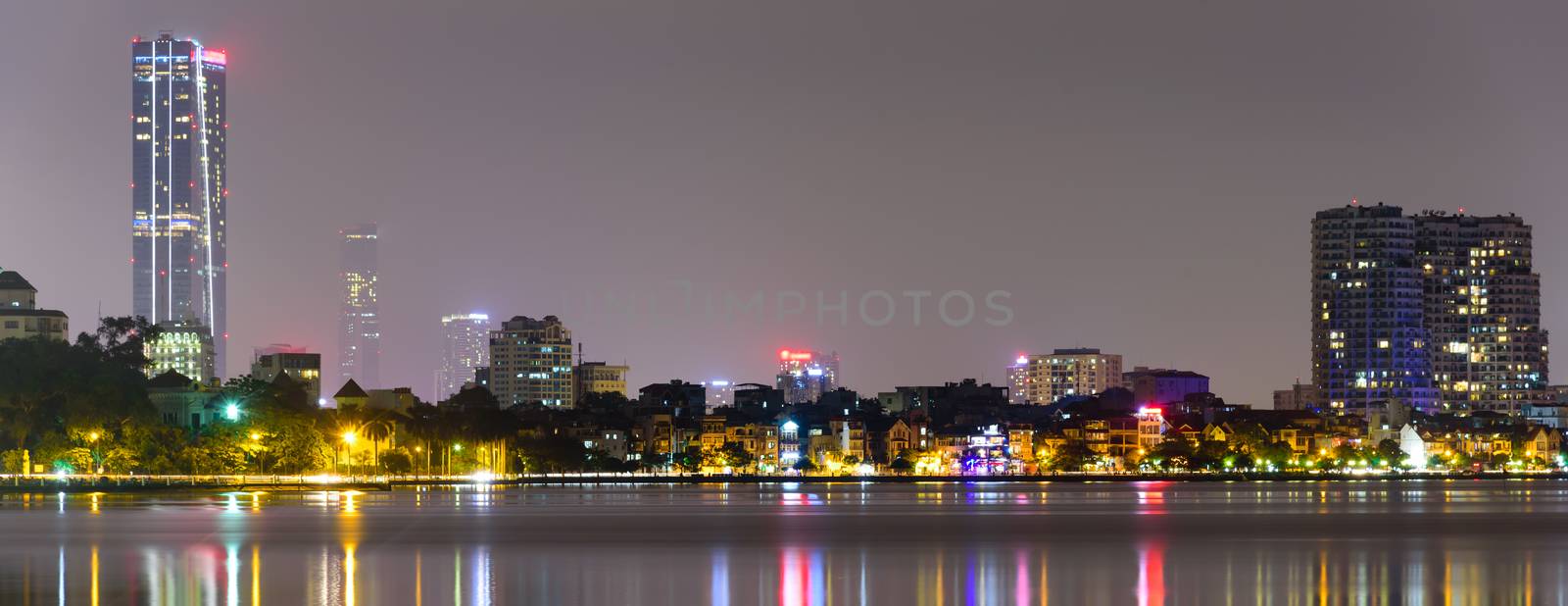 Panoramic colorful skyline reflection of downtown Hanoi skyscrapers from West Lake by trongnguyen