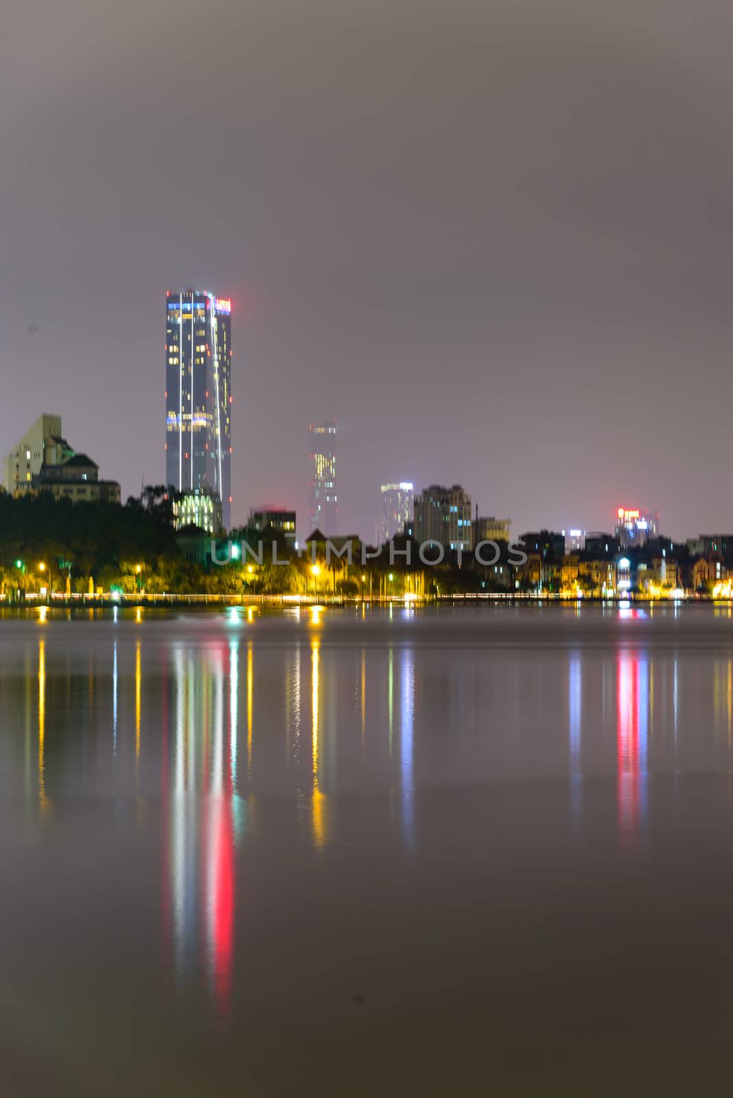 Blurred motion Hanoi skylines reflection at West Lake Ho Tay . Hanoi is capital of Vietnam. Colorful cityscapes and urban concept
