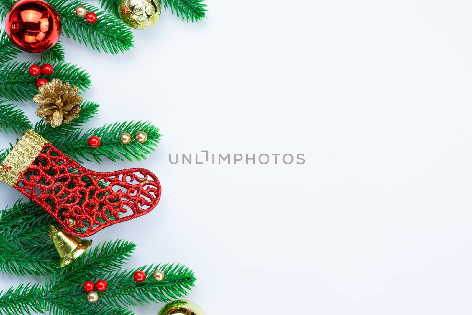 Christmas holidays composition, top view of red and gold Christmas decorations on white background with copy space for text. Flat lay, winter, postcard template, new year concept.