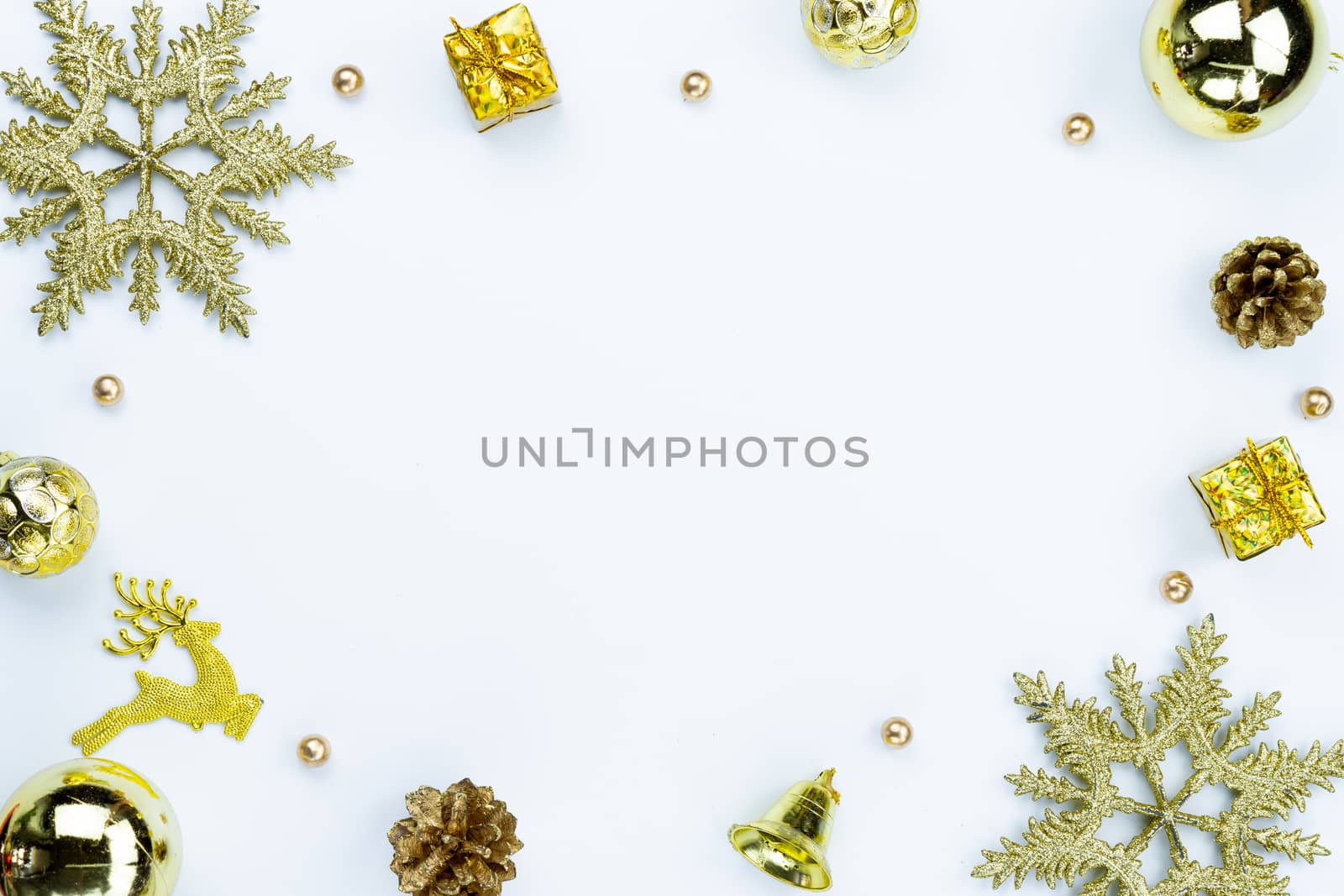 Christmas holidays composition, top view of red and gold Christmas decorations on white background with copy space for text. Flat lay, winter, postcard template, new year concept.