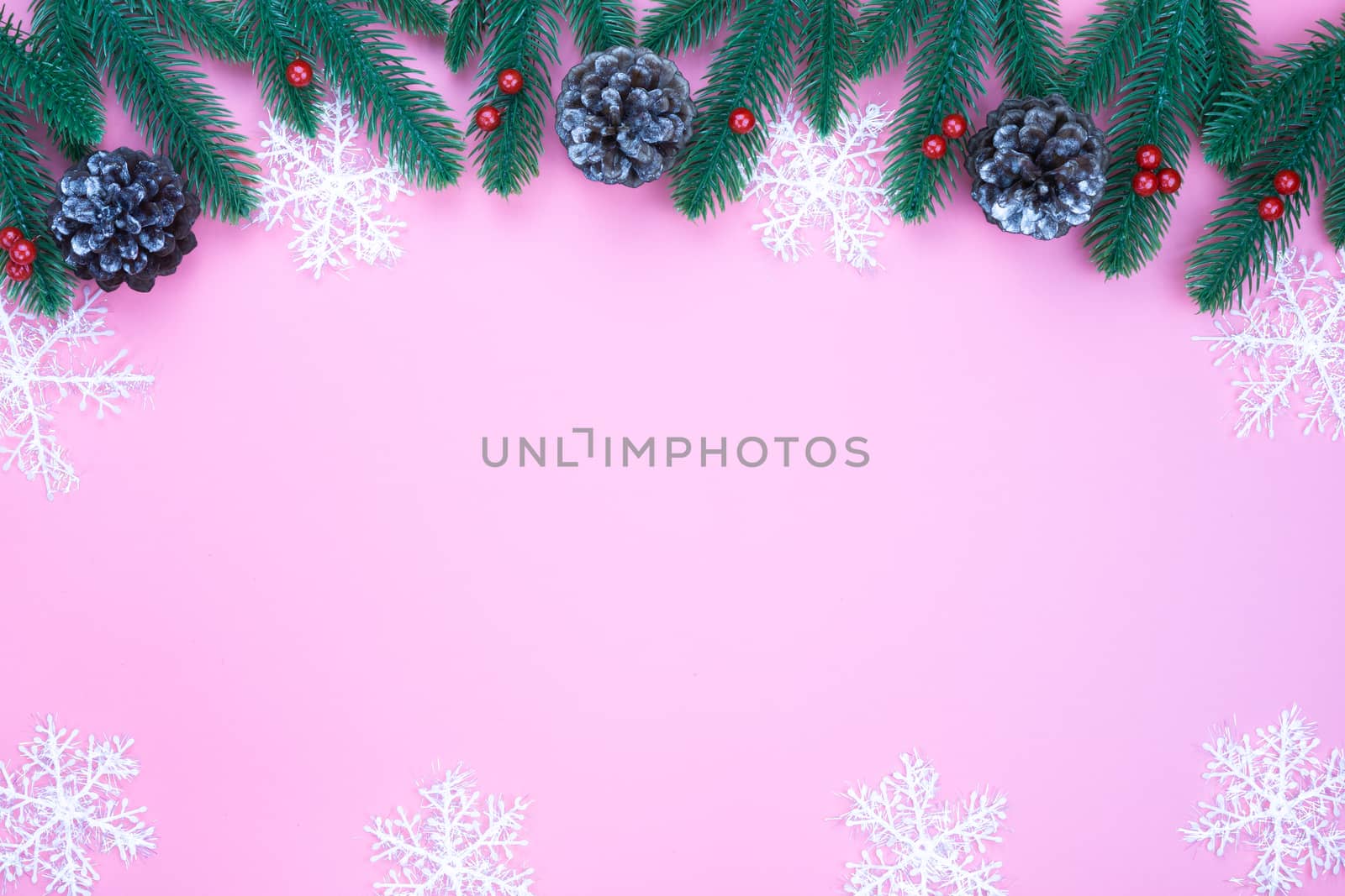 Christmas holidays composition, top view of red Christmas decorations on pink background with copy space for text. Flat lay, winter, postcard template, new year concept.