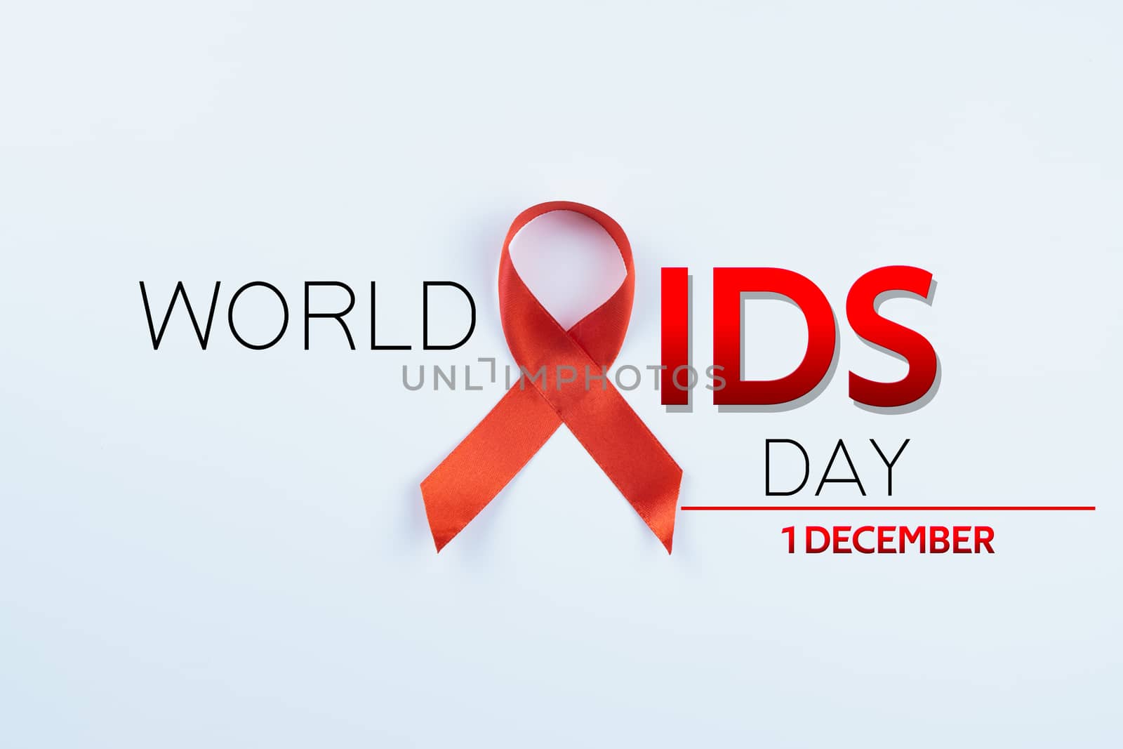 Aids awareness, red ribbon on white background with copy space for text. World Aids Day, Healthcare and medical concept.