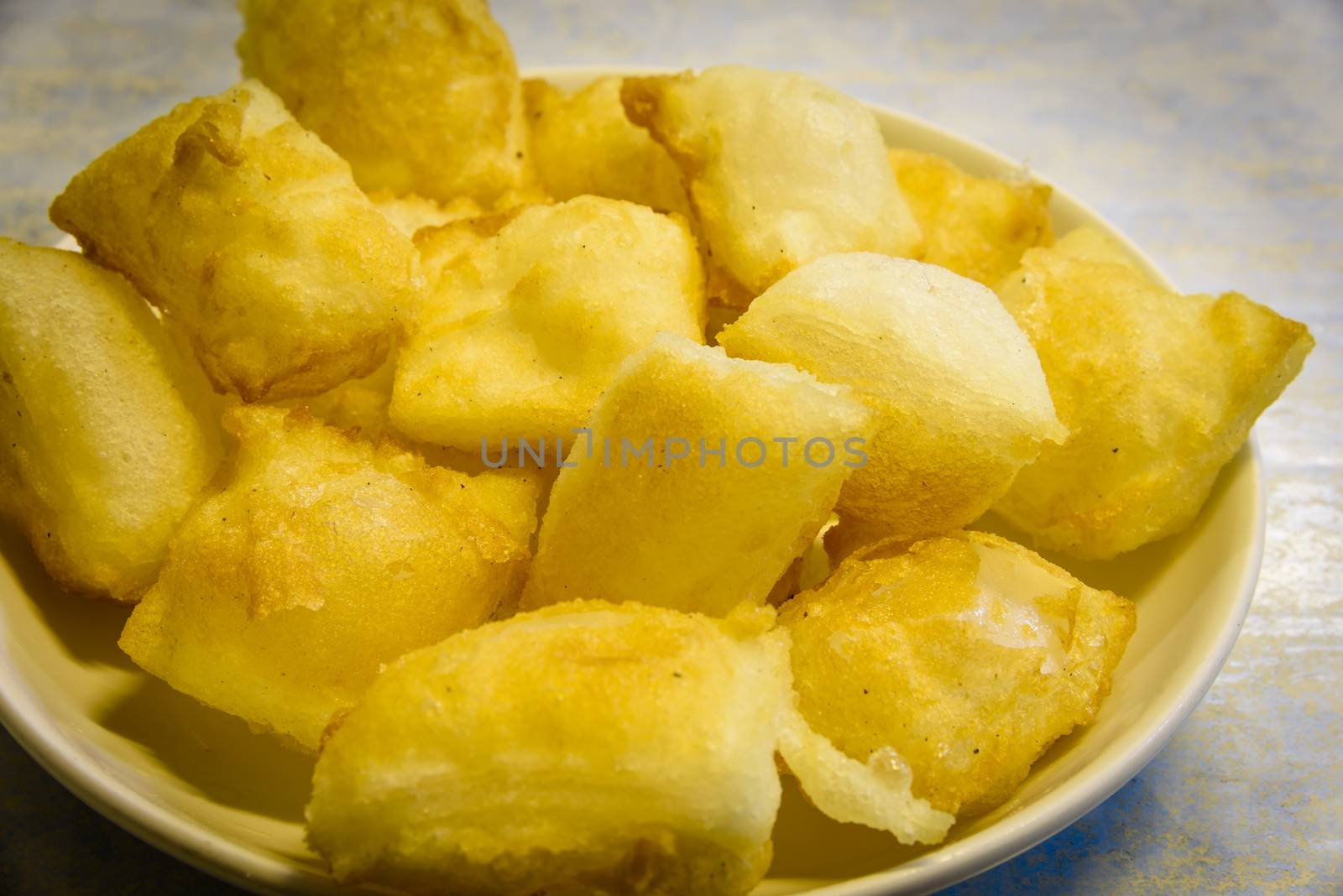 Close-up top view dish of deep fried pillows of rice noodle (Pho chien gion) by trongnguyen