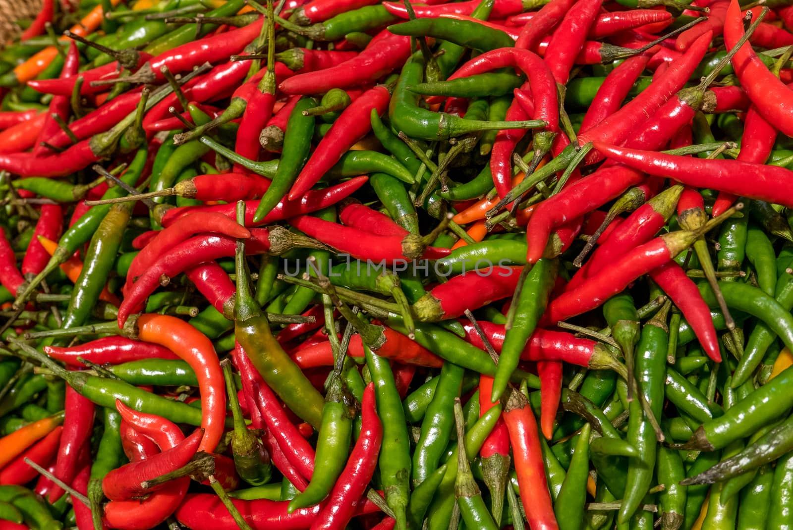 vegetables and condiments made of peppers and multicolored peppers on a stall