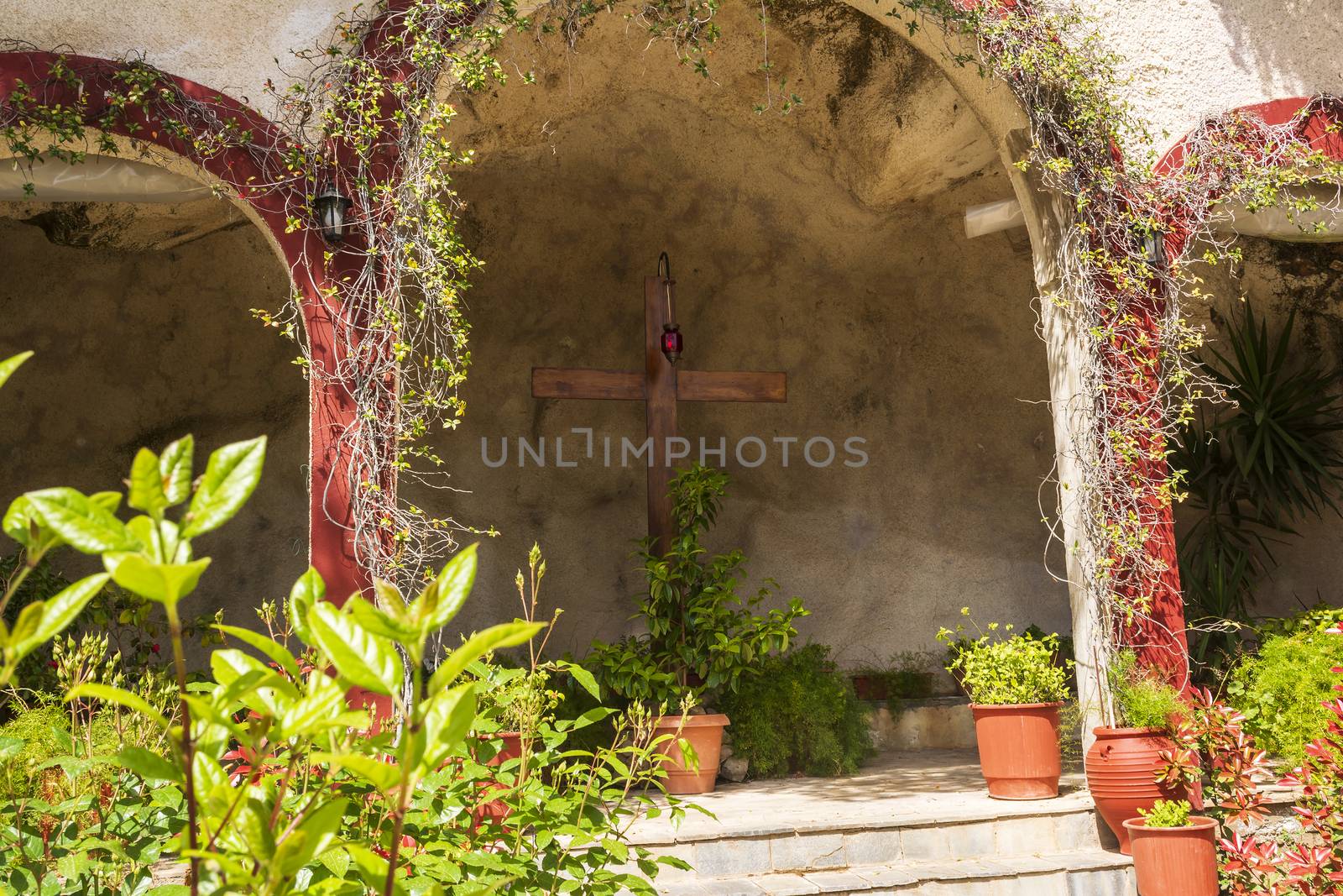 Big wooden cross inside the Orthodox monastery Moni Agiou Ioanni Theologou by ankarb