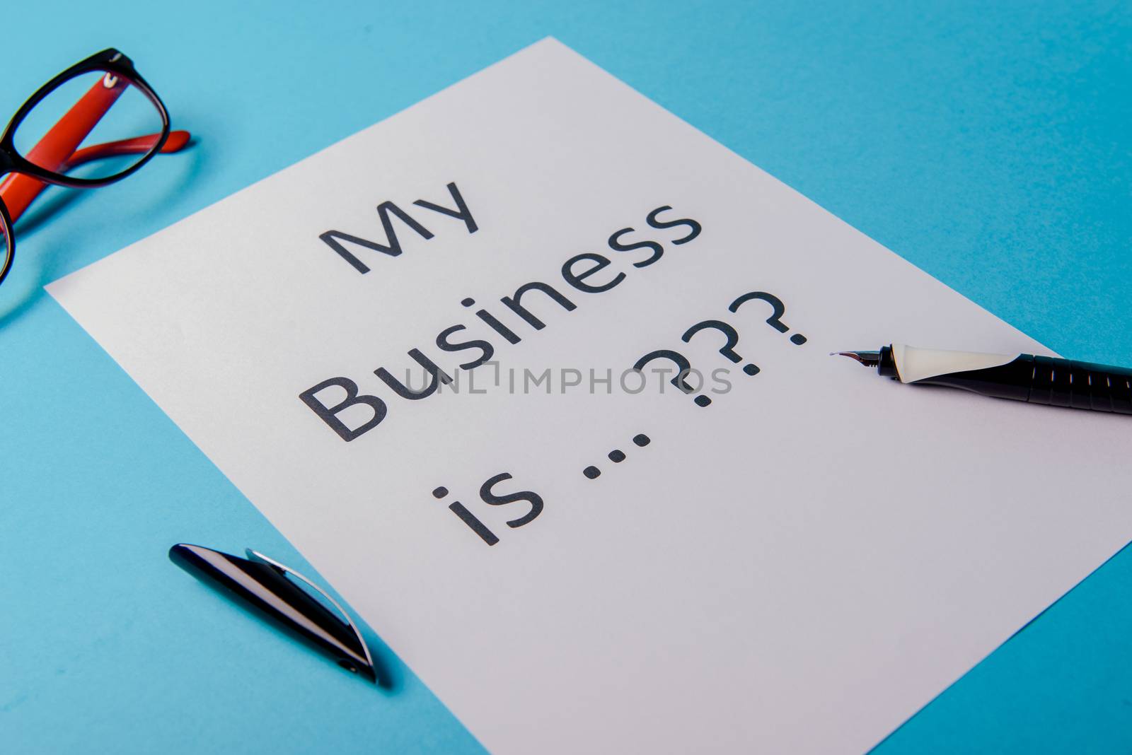 My business is word concept. Business word with business document paper on blue background. For business concept ideas background.