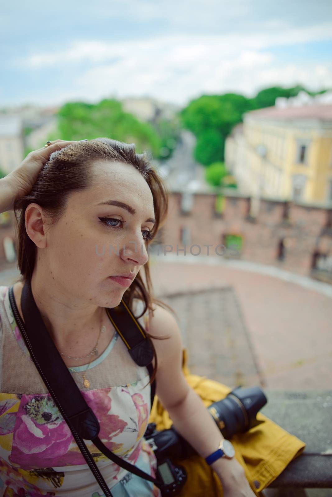 Beautiful girl during sightseeing old castle in Cracow, Wawel. Summer time