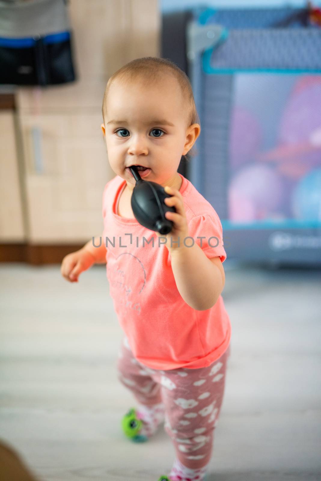 Portrait of adorable baby girl. Childhood. Authentic image
