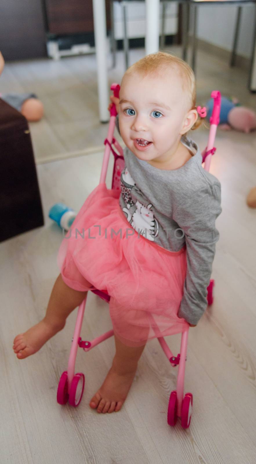 Portrait of adorable baby girl. Childhood. Authentic image