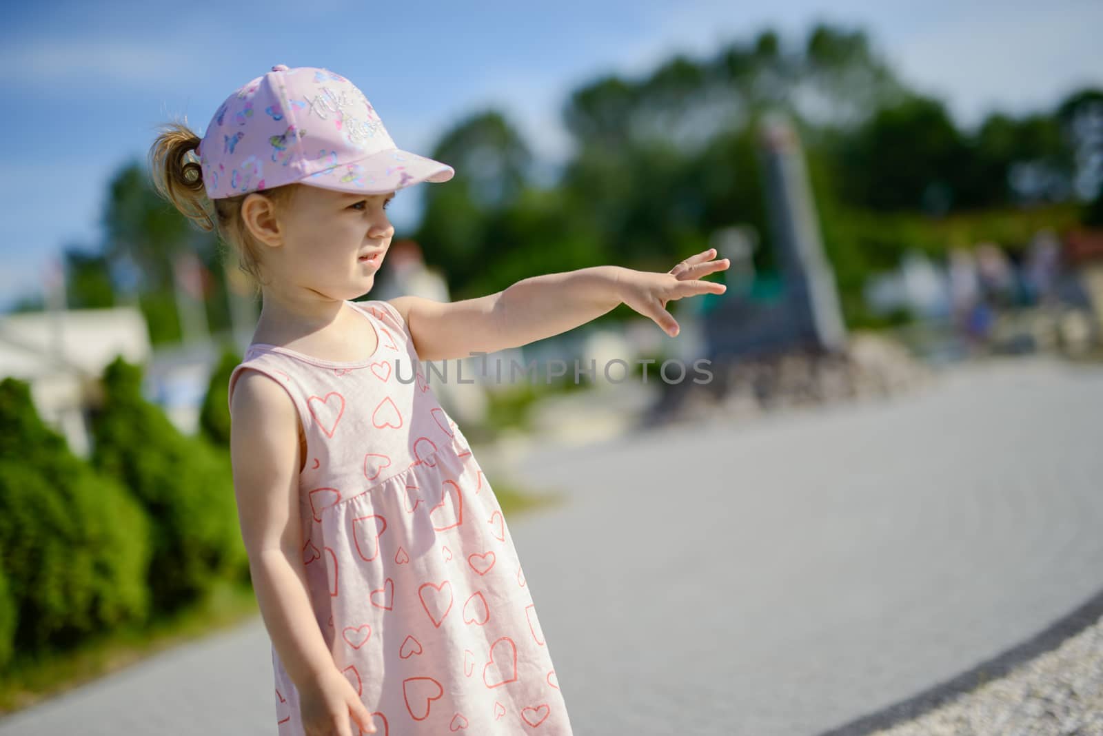 Little girl spending fantastic time on playground. Happy childhood. Authentic image