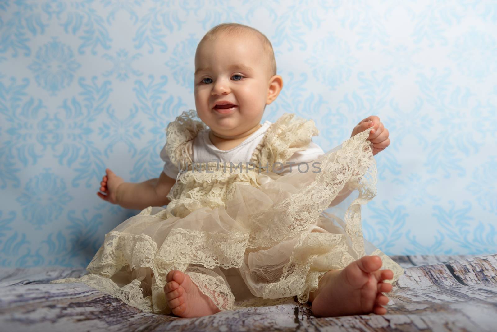 Portrait of adorable baby girl. Childhood. Authentic image