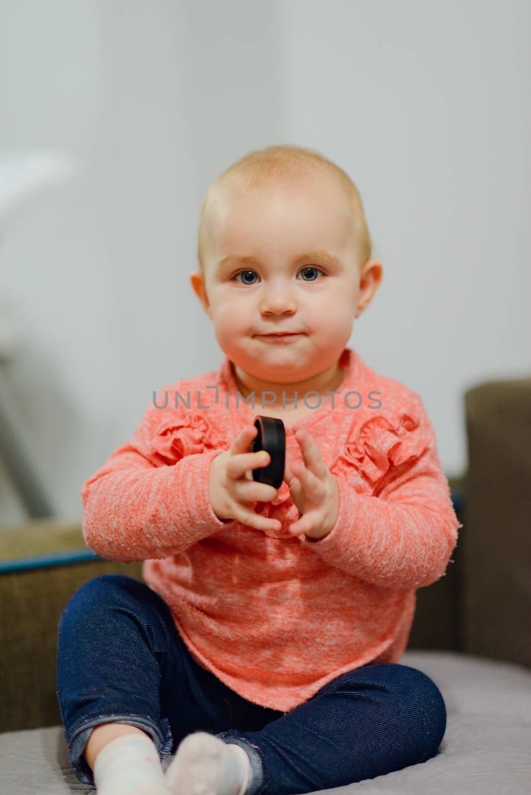Portrait of adorable baby girl. Childhood. Authentic image