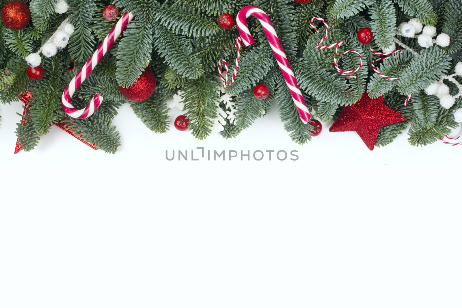 Christmas design boder frame greeting card of noble fir tree branches and baubles isolated on white background