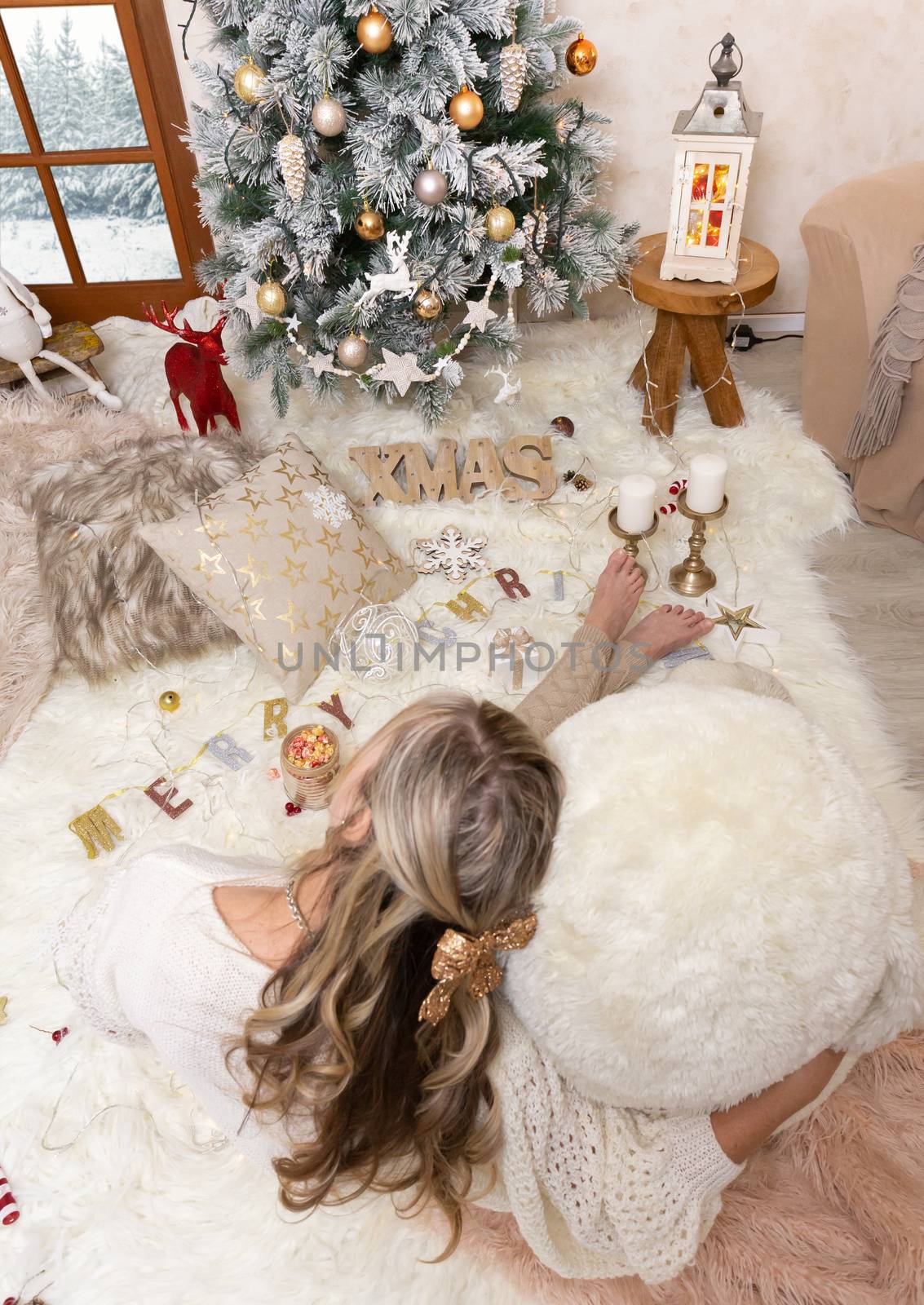 Cozy Christmas in front of the Christmas tree by lovleah