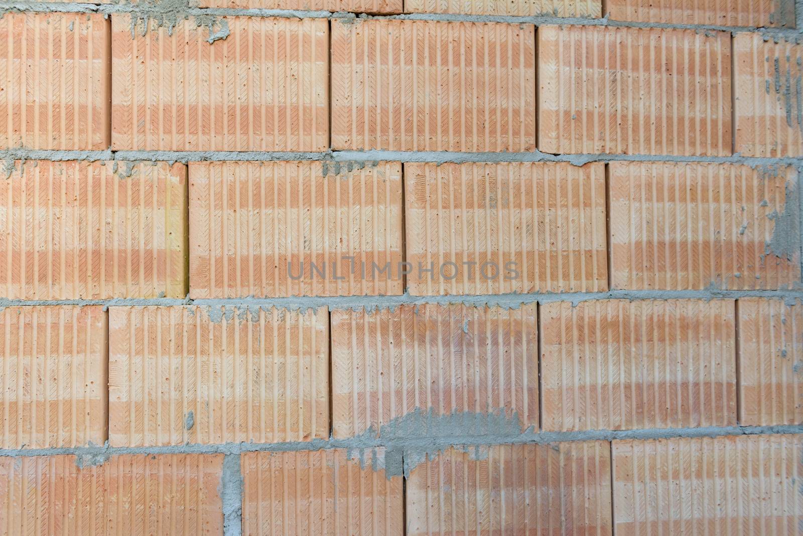 Interior of a Unfinished Red Brick House Walls under Construction without Roofing.