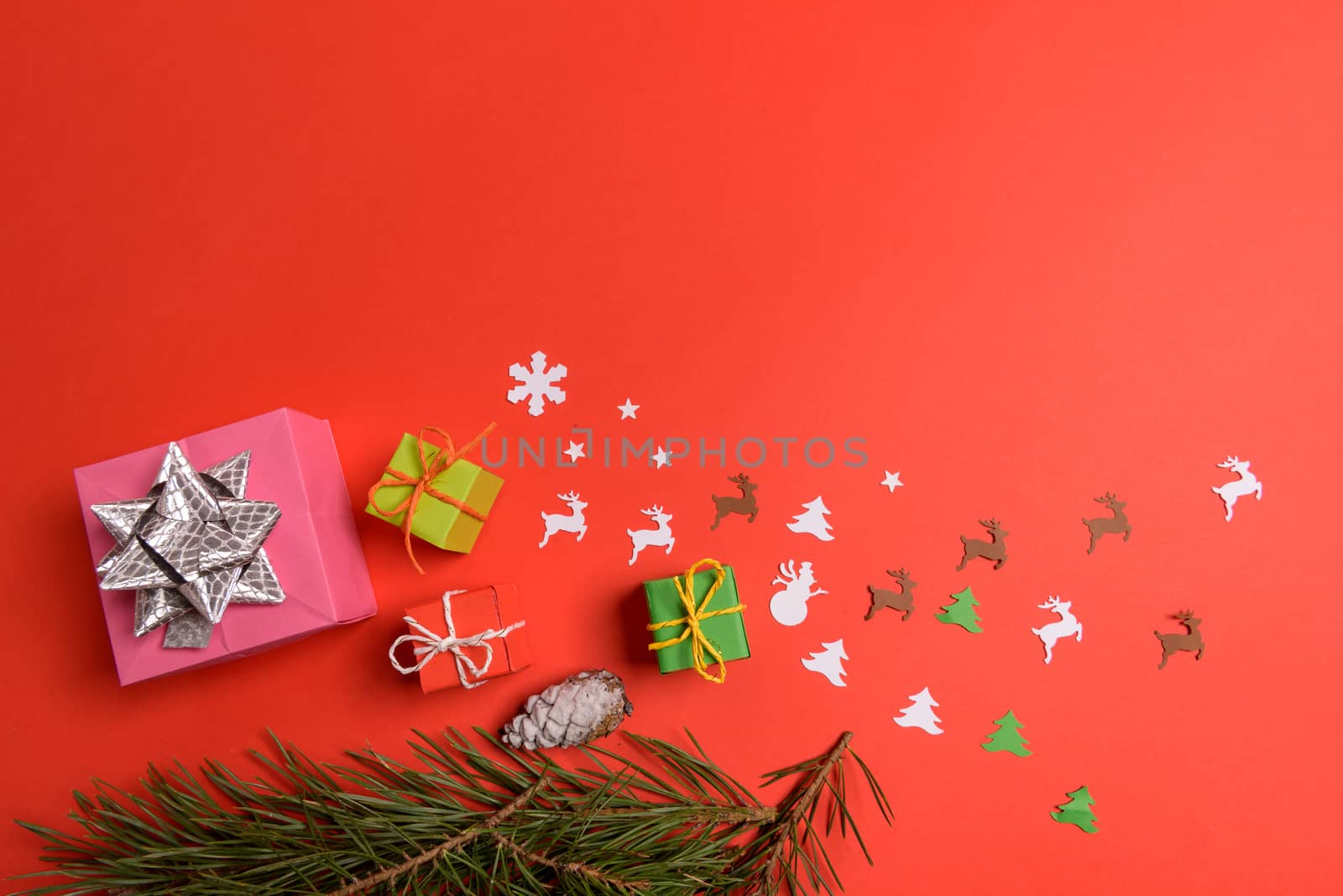 Christmas or New Year background, plain composition made of Xmas decorations and fir branches, flat lay, blank space for a greeting text.
